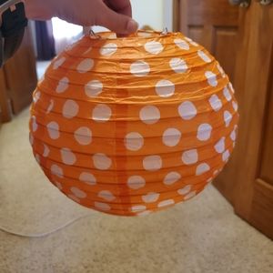 Orange with white polka-dots globe decoration. 10in diameter.